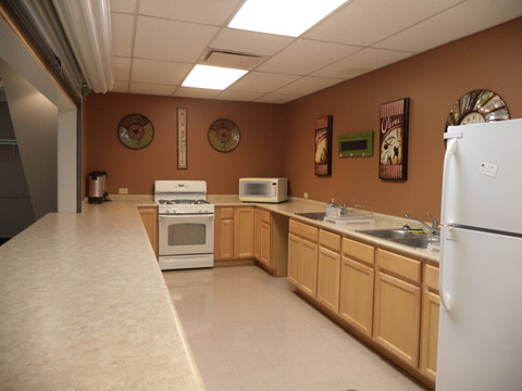 Community Center kitchen with oven, sink, microwave and refrigerator