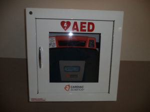 AED device in protective case on the wall