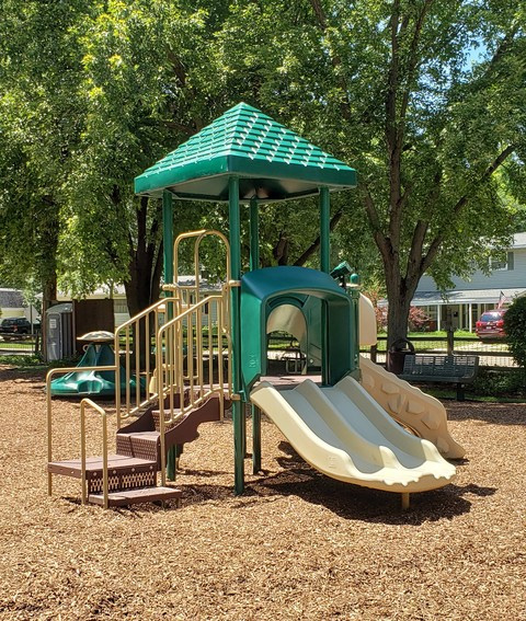 Children's jungle gym in playground with steps and slides