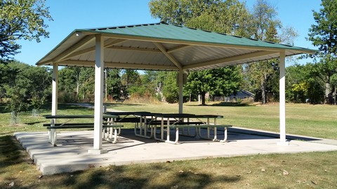 Lake Park Picnic Shelter with picnic tables on concrete foundation