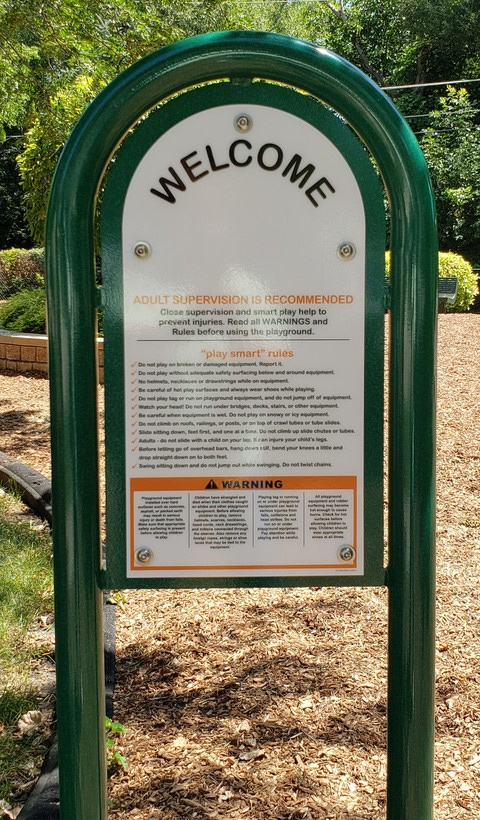 Adam's Park welcome sign showing rules and Park warnings