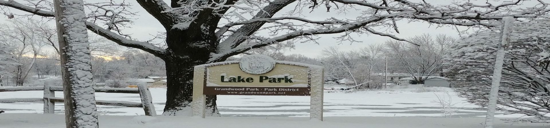 photo of lake park sign with snow