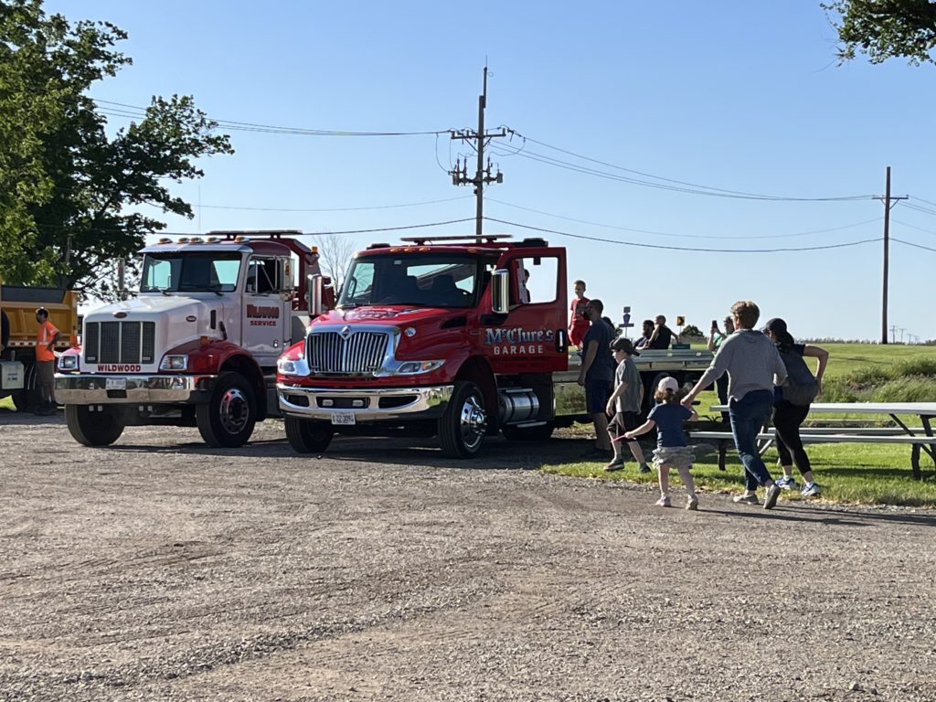 photo of people looking at vehicles at a Touch a Truck event