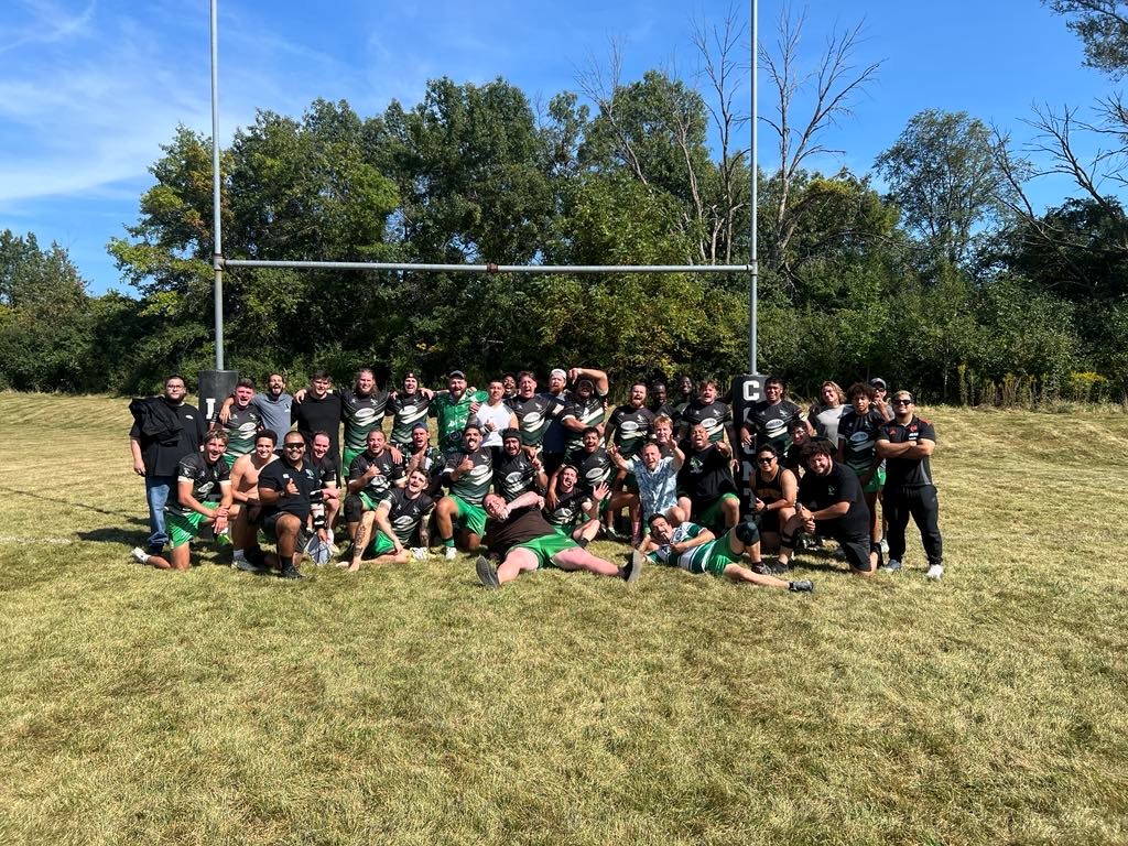 picture of rugby team in front of a goal post